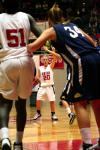 Kayla Hudson looks for an open player while calling a play.  Josephine Owino waits under the basket for an opportunity to score during the semi-final game of the NAIA tournament against Vanguard. - Photo by Kristi McMurry