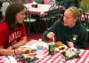 Rachel Fillinger, sophomore biology major, and Katie Sale, sophomore learning foundations major, talk over their delicious barbeque lunch provided and prepared by the team members at Gwatney Chevrolet in Memphis, TN.   - Photo by Kristi McMurry