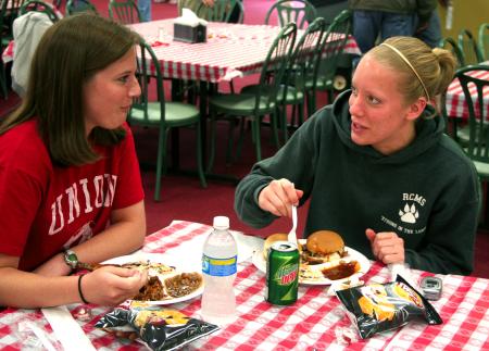 Rachel Fillinger, sophomore biology major, and Katie Sale, sophomore learning foundations major, talk over their delicious barbeque lunch provided and prepared by the team members at Gwatney Chevrolet in Memphis, TN.  