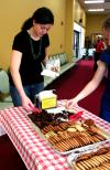 Kayla McKinney, sophomore learning foundations major, gets a cookie at the dessert table during the barbeque lunch provided and prepared by the team at Gwatney Chevrolet. - Photo by Kristi McMurry