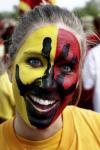 Claire Yates paints Chi Omega colors on her face to support her sorority during the Greek Olympics. - Photo by Kyle Kurlick