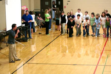 Kyle Sanders, senior international business major, calls out red light, yellow light, green light to kids in the area during a SIFE event at Union.  SIFE directed games, projects, and lunch for the kids.