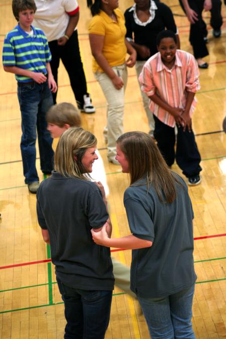 Kelsey Goostree, junior teaching English as a second language major, and Michelle Mangham, sophomore business administration major, help judge the game played during the SIFE event at Union. SIFE directed games, projects, and lunch for kids in the area.