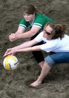 Emily Alm, freshman nursing major, and Jill Brown, sophomore Christian studies major, dive for the ball during the volleyball tournament that raised money for the disaster relief fund. - Photo by Kristi McMurry