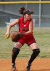 Candace Cross fields the ball and tosses it to first base. - Photo by Steven Aldridge