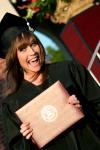 Allison Hays, public relations/advertising major, proudly displays her diploma right after receiving it at the Spring 2008 graduation. - Photo by Kristi McMurry