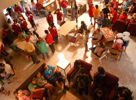 Faculty, staff, current students and returning students gather in McAfee commons waiting to help the new students.