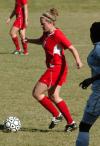 Candice Blackard controls the ball with defenders in close range. - Photo by Steven Aldridge