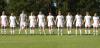 The starters for Union stand during the pre-game prayer and National Anthem. - Photo by Steven Aldridge