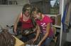 Elaura Highfield, freshman from Columbia, Tenn., and her cousin Colleen Coble of Hampshire, Tenn., unpack her things into her room in the Heritage residence complex. - Photo by Sarah Palmer