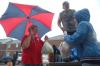 Though the rain beat harder, students and faculty were still persistent to unload trucks full of dorm furnishings. Here Nursing faculty member Sandra Brown helps bring in groceries. - Photo by Beth Spain