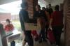 Cramped balconies and tight spaces were quite the norm as parents, students and faculty raced to move freshmen belongings from rainy conditions to the new dorms.  - Photo by Beth Spain