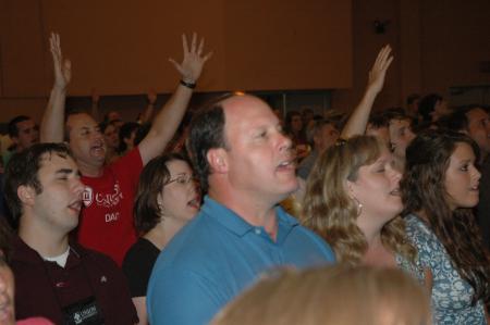 New students and their families offer up praise during the evening worship service.