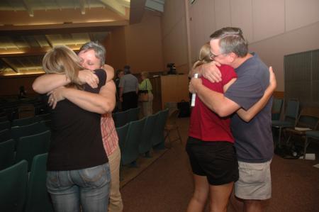 The Schriebers embrace their daughters before heading back home to Murfreesboro, Tenn. after the Focus evening worship service. 