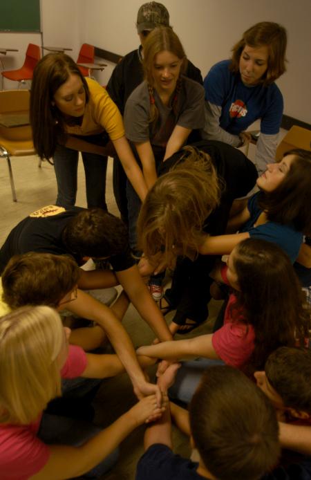 Ellen Kay's FOCUS group tries to untangle themselves from a human knot during a team building exercise.