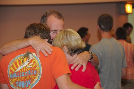 Parents pray with their student as they say goodbye after the Focus evening worship service.