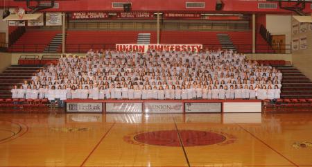 The Class of 2012 poses for a group shot in the Fred DeLay Gymnasium.