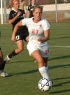 Katelin Dirksen moves the ball quickly away from defenders. - Photo by Tommy Sadler