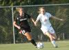 Brooke Walker attempts to keep the ball away from a Freed-Hardeman deefender in Union 1-0 win. - Photo by Tommy Sadler