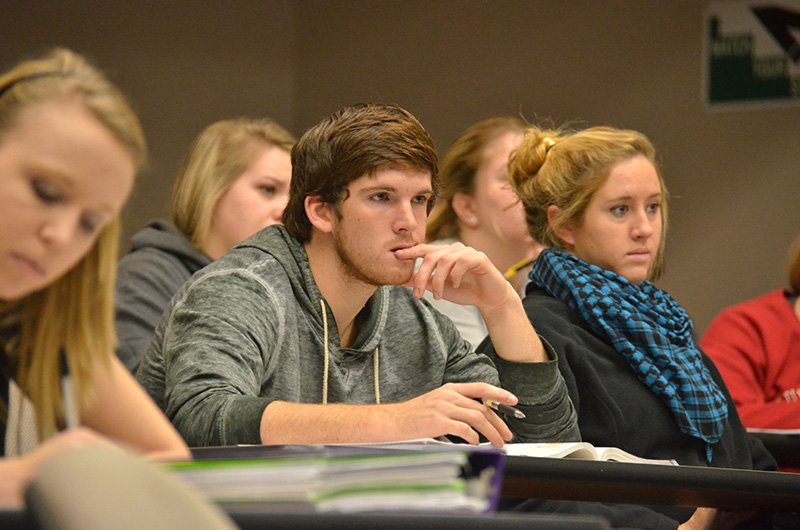 Students Hannah Hughley, Luke Scogin, and Rachael Boswell listen to Phil Davignon’s presentation on Christian sociology.