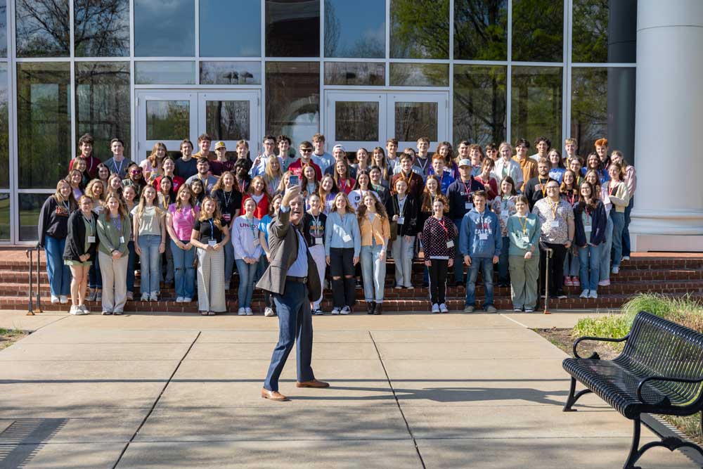 Dub takes a selfie with new students at Accepted Student Day