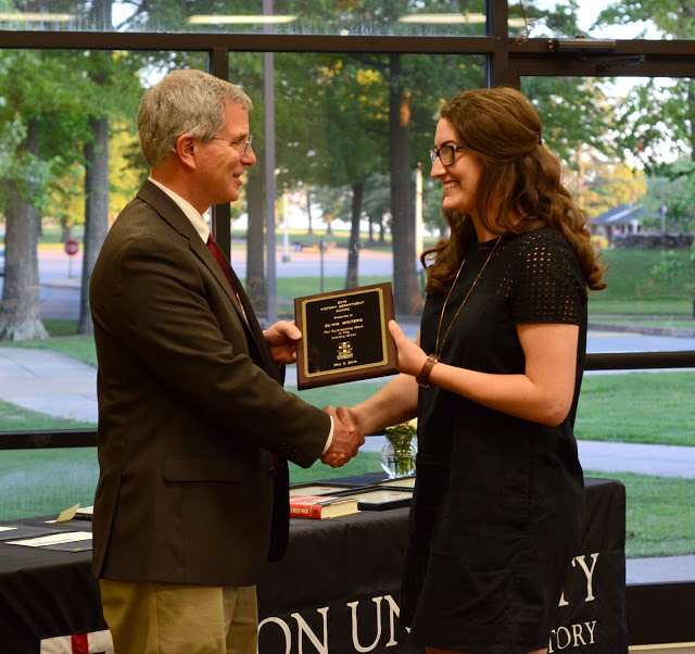Dr. David Thomas congratulates Olivia Winters at the history awards banquet on May 5, 2016, on her History Minor Award. Photo by MiKalla Cotton