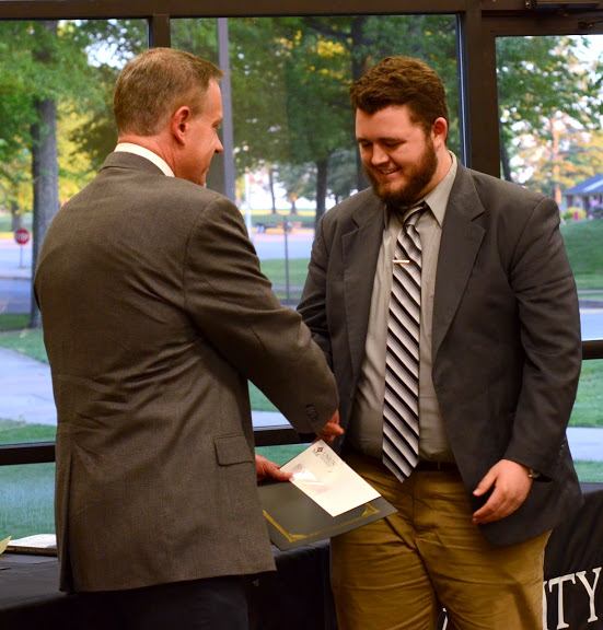 Dr. Henry Allen (left) congratulates Nicholas Hancock at the history awards banquet on May 5, 2016, for winning third place in the Dr. James Alex Baggett History Research Paper Competition. Photo by MiKalla Cotton
