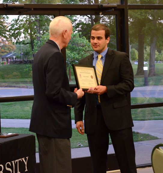 Dr. Stephen Carls (left) presents a certificate of appreciation to Allen Bradley at the history awards banquet on May 5, 2016, for his work as vice president of Phi Alpha Theta in 2015-2016. Photo by Mikalla Cotton