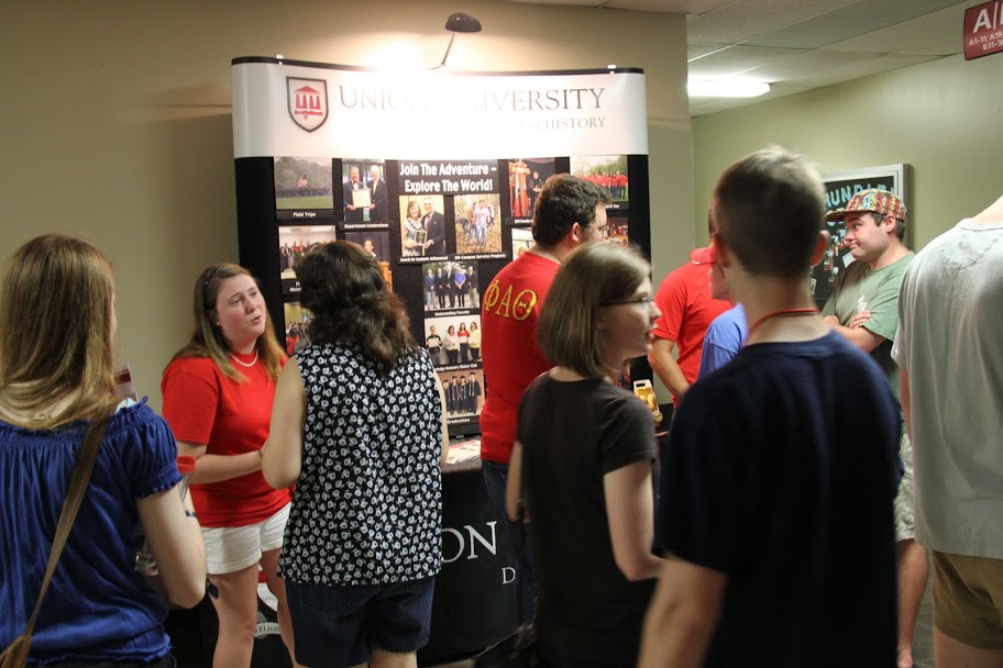 Officers from the history department's student organizations talk to classmates at the history display table during the Student Organizations Fair on August 17, 2015.