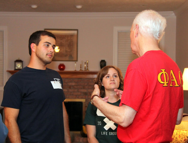 Dr. Stephen Carls (right) talks to students Allen Bradley and Abby Thigpen at the History Welcome Reception on August 31, 2015. Photo by Kristi Woody