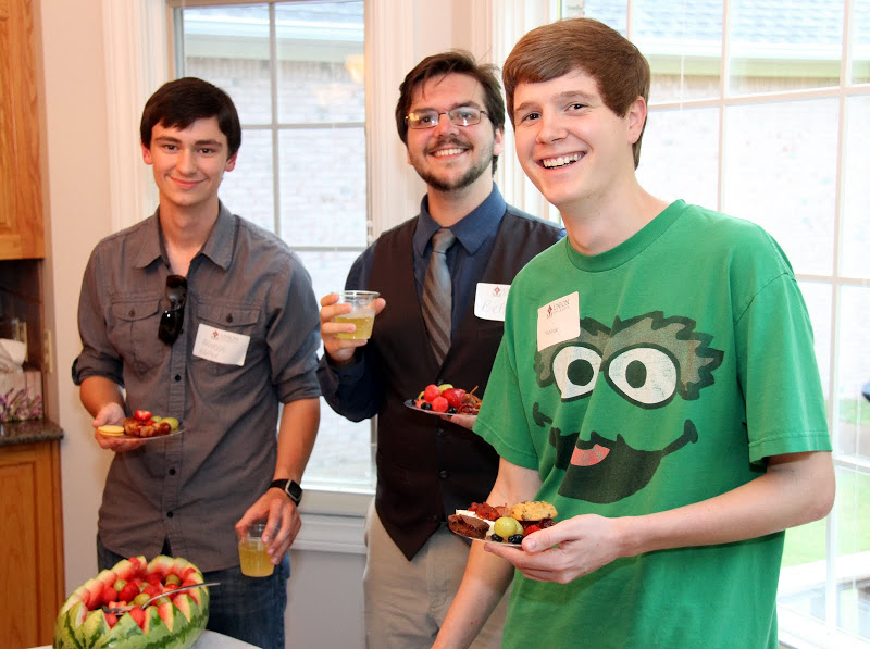 Union students (left to right) Brandon Harper, Ben Pinkley, and Thomas Gray go through the serving line at the History Welcome Reception on August 31, 2015.