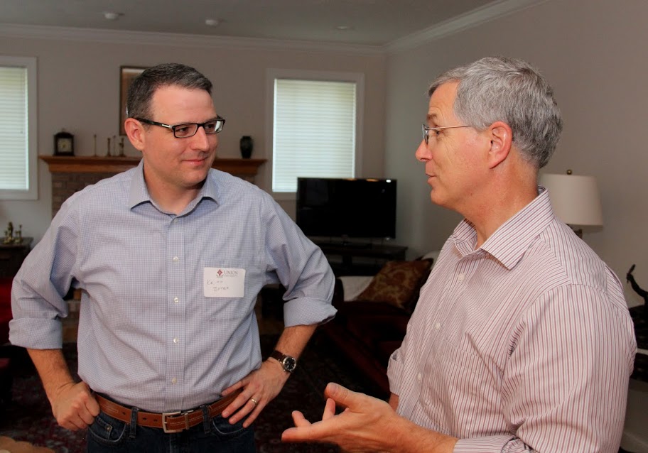 Drs. Keith Bates (left) and David Thomas enjoy a conversation together at the History Welcome Reception on August 31, 2015.