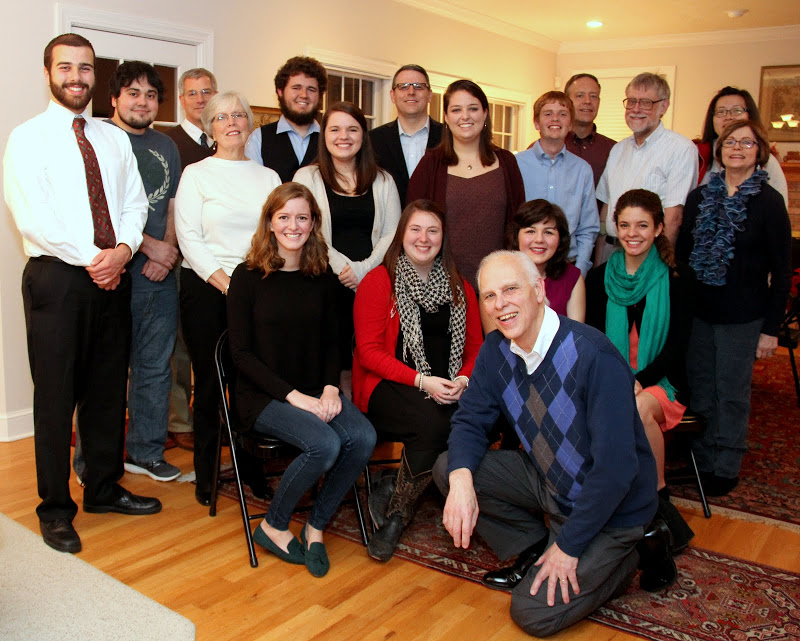 Attendees at the Franco-American Christmas dinner on December 5, 2015, join together for a group photo at the beginning of the evening. They are: (front, kneeling) Dr. Stephen Carls; (seated, left to right) Beth Adams, Kathryn Mitchell, Priscilla Porter, and Karis Lancaster; (standing, third row) Allen Bradley, Nancy Thomas, Jordan Sellers, Emily Littleton, Gideon Ragland, Dr. Terry Lindley, and Becky Lindley; (back row, left to right) Ashton Hostetler, Dr. David Thomas, Nicholas Hancock, Dr. Keith Bates, Dr. Henry Allen, and Haelim Allen. Hostess Dr. Alice-Catherine Carls took the photo.