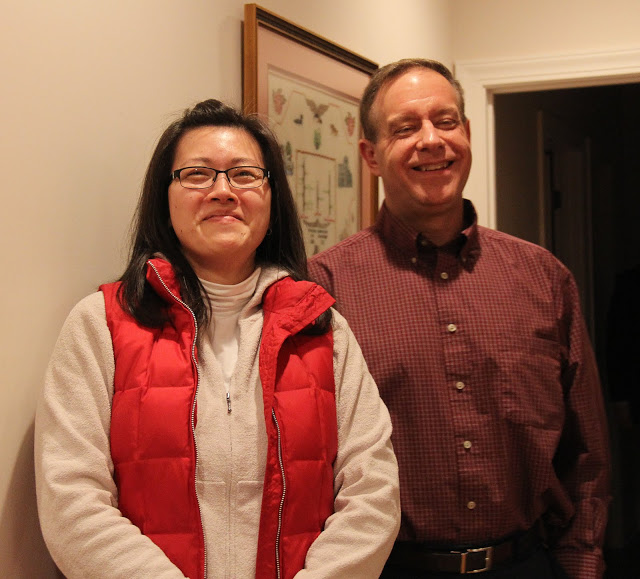 Dr. Henry Allen and his wife Haelim smile for the camera at Franco-American Christmas dinner on December 5, 2015.