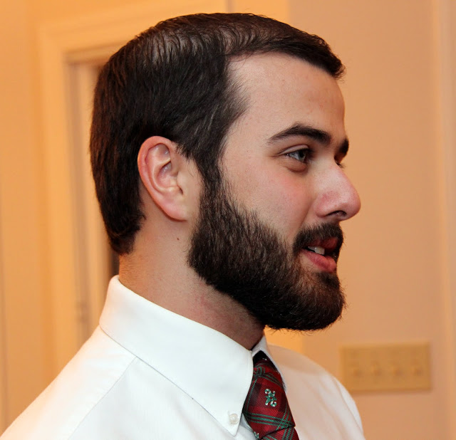 Allen Bradley engages in conversataion at the beginning of the Franco-American Christmas dinner at the Carls's home on December 5, 2015.