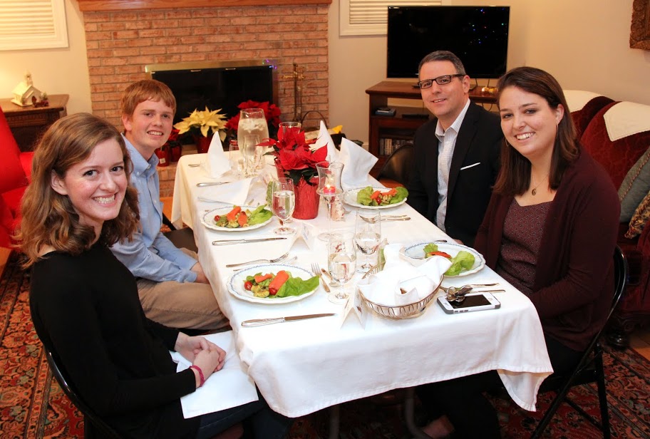 Attendees at the Franco-American Christmas dinner on December 5, 2015, prepare to eat their salads. They are (left to right) Beth Adams, Gideon Ragland, Dr. Keith Bates, and Emily Littleton.
