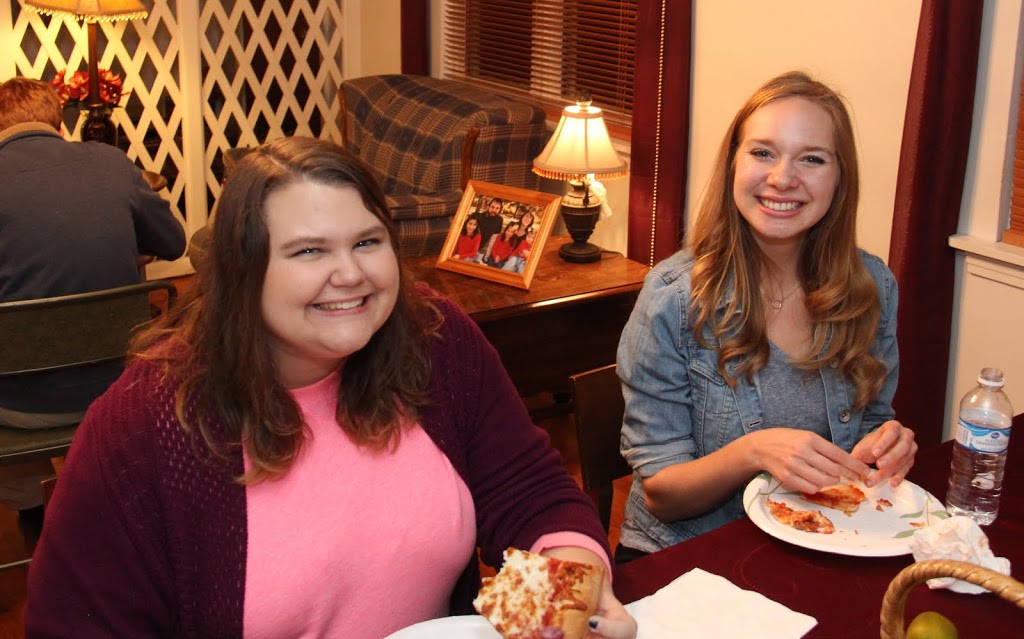 Jessica Barton (left) and Ali Renckens enjoy pizza and conversation together at the Rutledge Honorary History Club's fall pizza party on November 19, 2015.