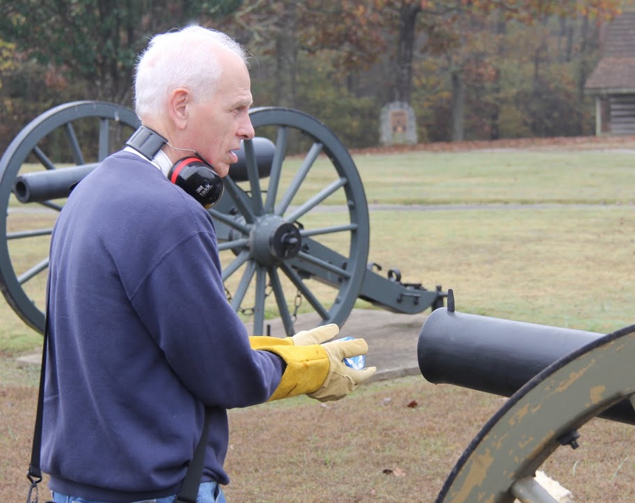 Dr. Stephen Carls loads a packet of gunpowder into the barrel of a cannon during a cannon firing exercise at Britton Lane Battlefield on November 3, 2015.