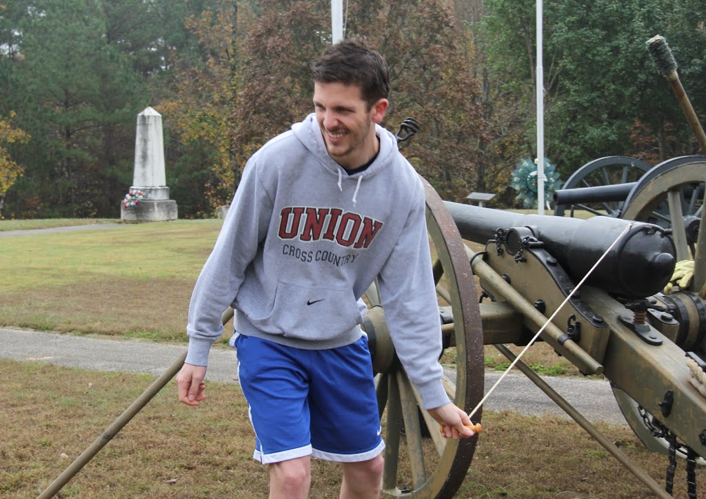 Logan Smith prepares to pull the lanyard (trigger cord) to ignite the gunpowder inside a cannon during the Phi Alpha Theta-sponsored community service project at Britton Lane Battlefield on November 3, 2015.