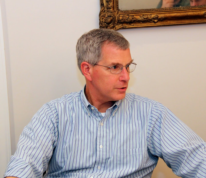 Dr. David Thomas engages in conversation with students at the Phi Alpha Theta Best Chapter Award pizza party on October 16, 2015.
