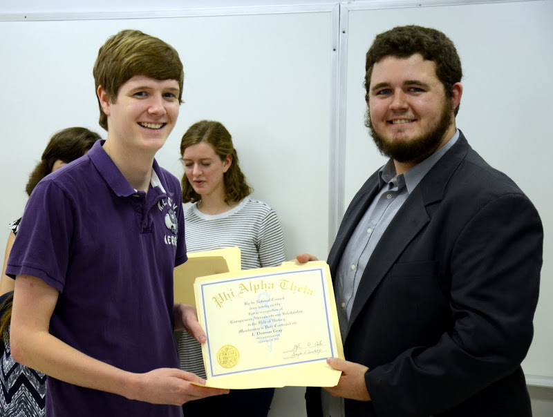 Delta-Psi President Nicholas Hancock (right) gives Thomas Gray his Phi Alpha Theta membership certificate at the Delta-Psi chapter's fall initiation/plenary meeting on September 14, 2015. Photo by Elizabeth Wilson