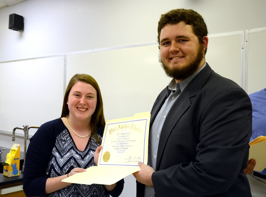 Delta-Psi Chapter President Nicholas Hancock presents Kathryn Mitchell with her Phi Alpha Theta membership certificate at the honor society's plenary meeting on September 14, 2015. Photo by Elizabeth Wilson