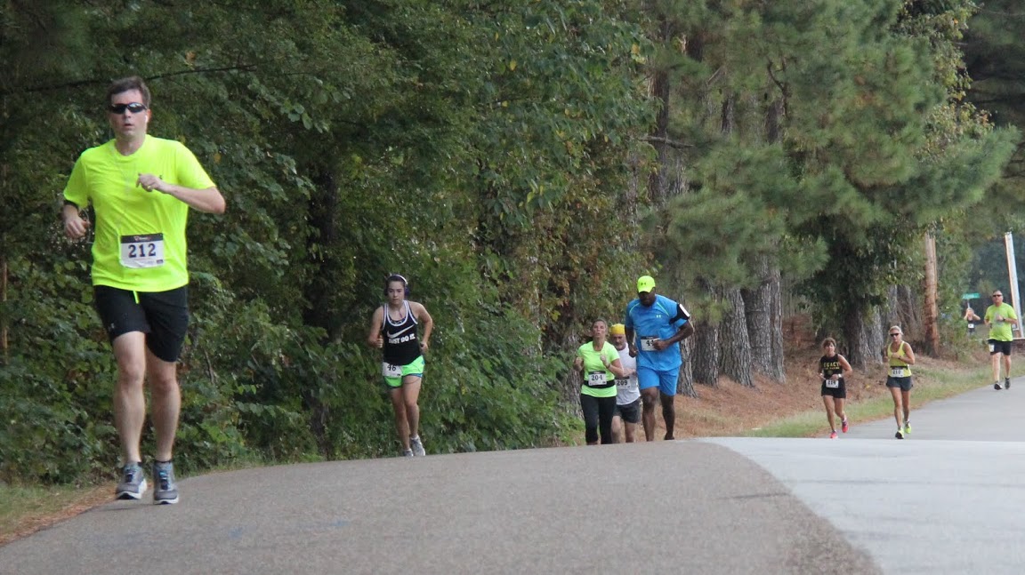 Participants in the Racing So They Can Ride event on September 19, 2015, run on the Rushmeade Road portion of the race.