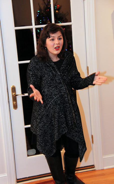 Phi Alpha Theta member Priscilla Porter recites an excerpt from Shakespeare's Twelfth Night as a part of the history department's Christmas dinner program on December 10, 2016.