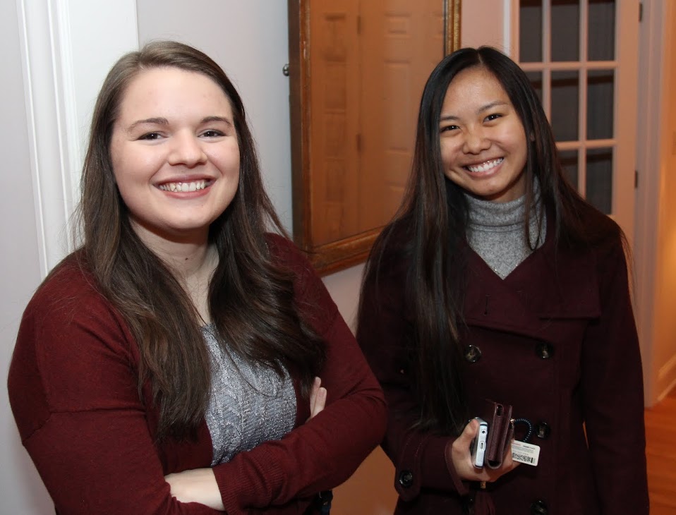 Jordan Sellers (left) and Katherine Cheshire get ready for the French Christmas dinner on December 10, 2016.