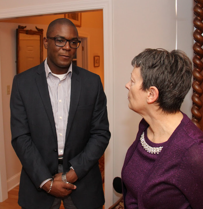 Graduating history major Byron Elam talks with Dr. Alice-Catherine Carls at the end of the Phi Alpha Theta Christmas dinner on December 10, 2016.