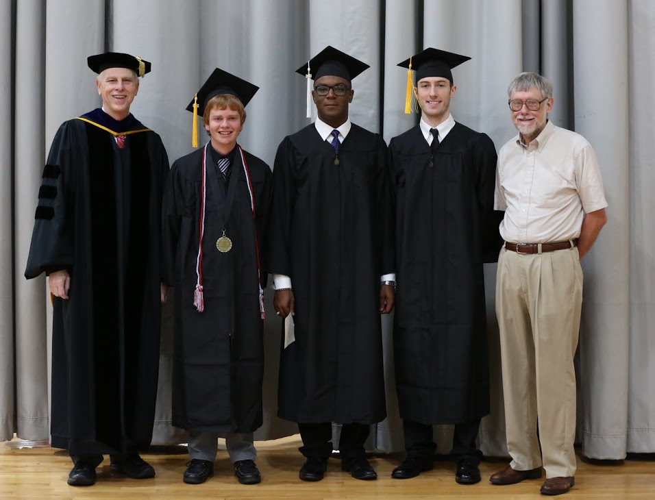Drs. Stephen Carls (left) and Terry Lindley (right) stand with graduating history majors Gideon Ragland (second from left, moving right), Byron Elam, and Luke Adkins at Union's fall commencement services on December 17, 2016. Photo by Kristi Woody