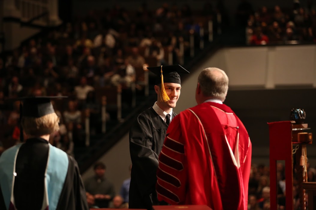 Dr. Samuel W. Dub Oliver congratulates history major Luke Adkins at Union's fall graduation on December 17, 2016, on Adkin's successful completion of a bachelor of science program in history. Photo by Kristi Woody