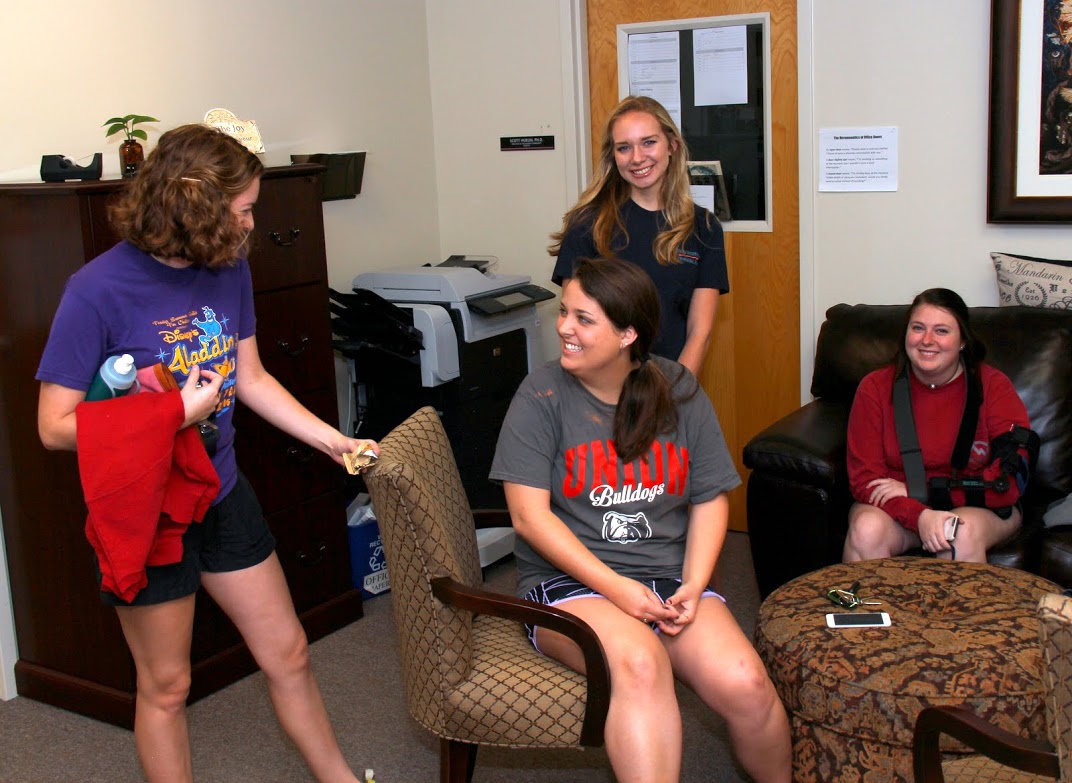 Student participants in the Phi Alpha Theta/History Department community service project on November 1, 2016, wait in the Jones Suite for the project to begin. They are (left to right) Beth Adams, Emily Littleton (wearing Union Bulldogs shirt) Ali Renckens, and Kathryn Mitchell.