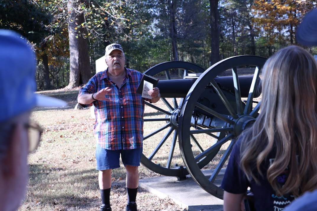 Malcom Wilcox, president of the Salem Cemetery Battlefield Association, talks about the two-hour battle that took place at the cemetery in 1862 during the Phi Alpha Theta/History Department community service project on November 1, 2016. Photo by Elizabeth Wilson